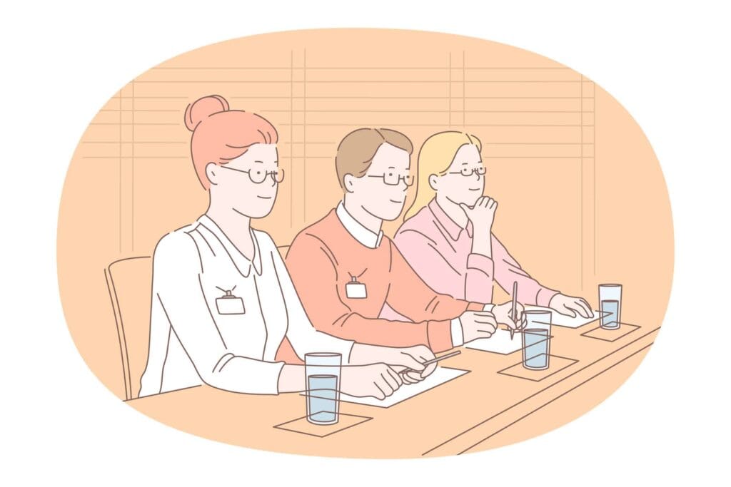 集合研修で講義を受ける複数の参加者たち